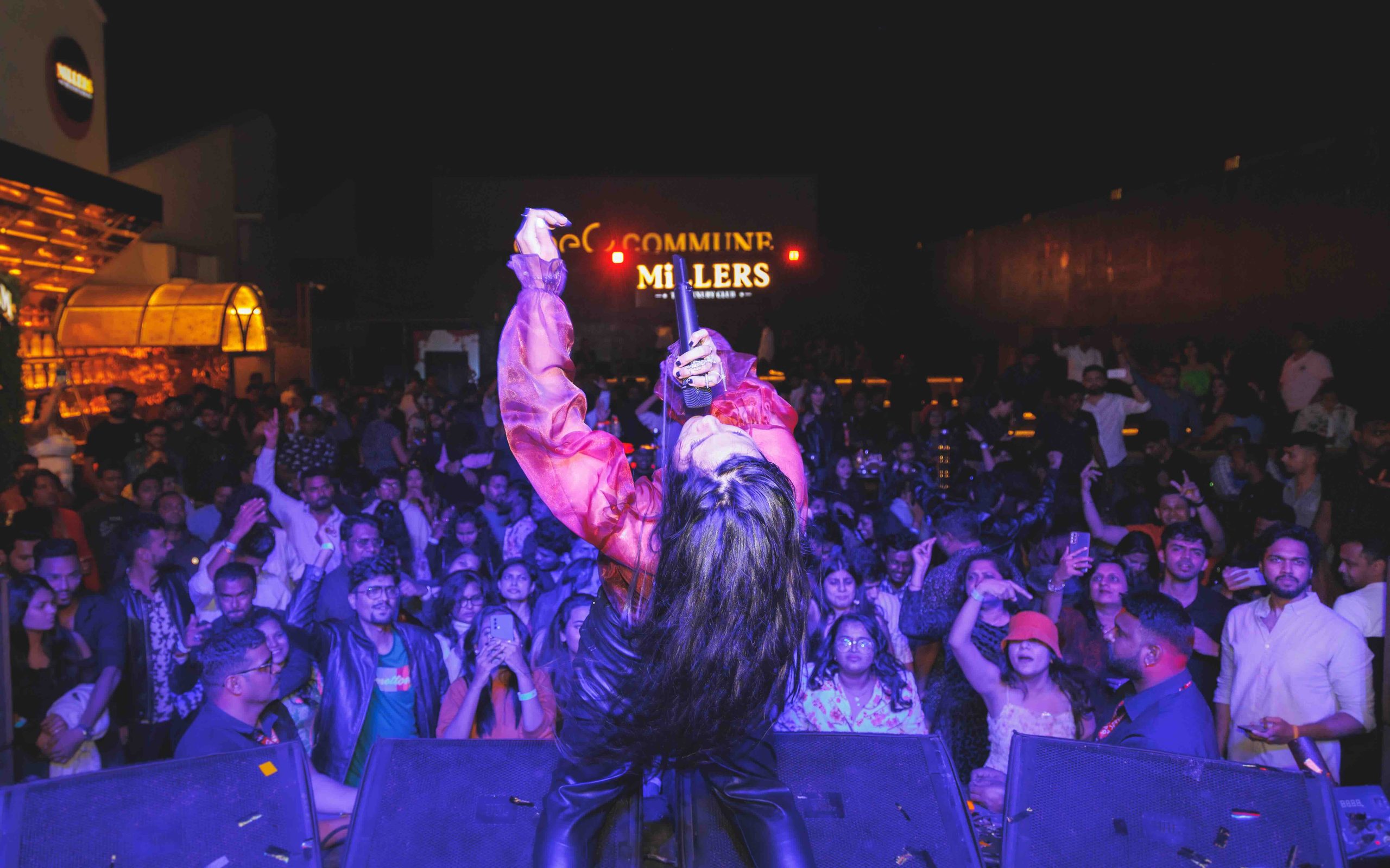 Wide view of a crowd at an outdoor concert